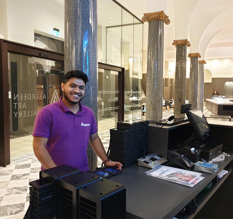 Imagineear employee at desk providing support