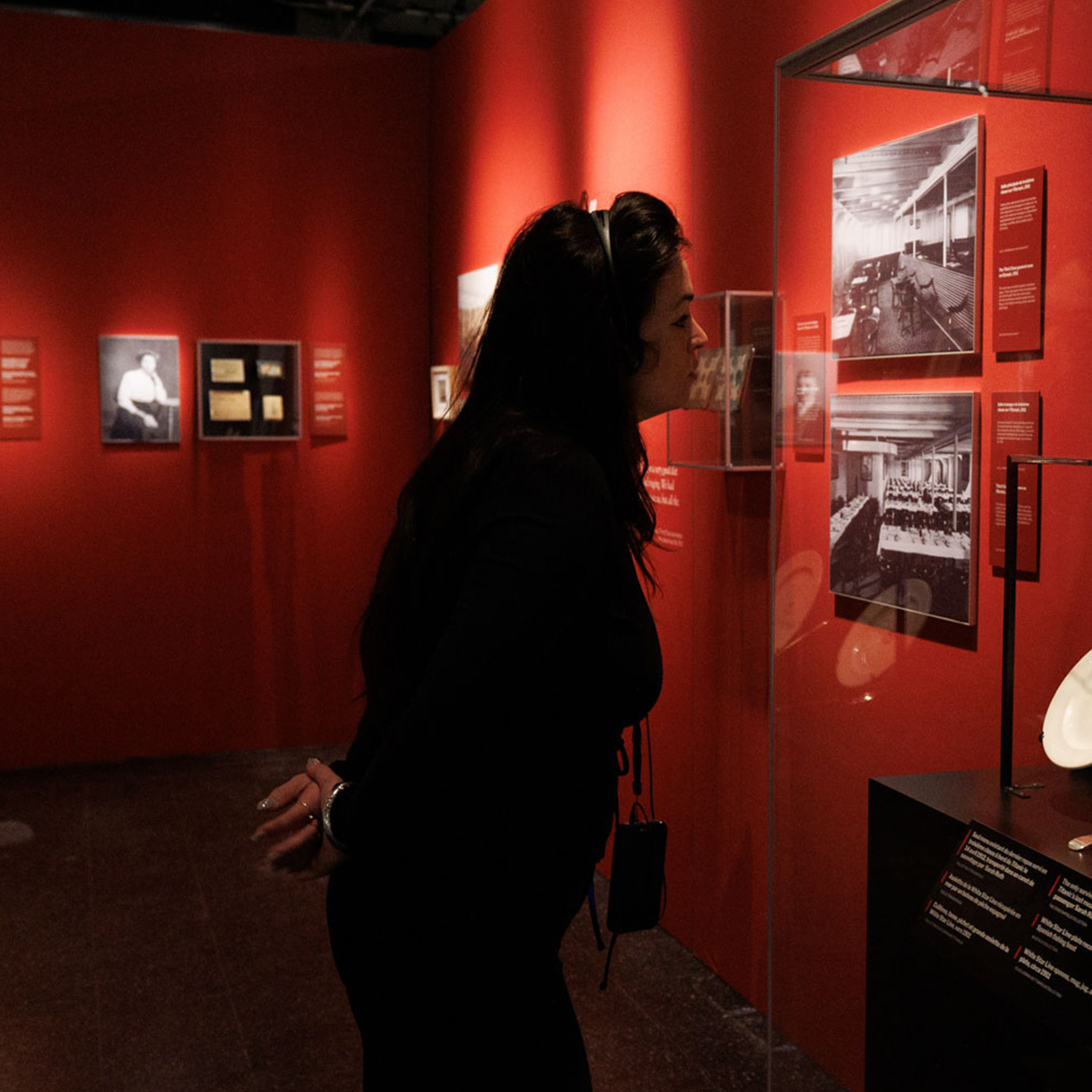 Woman with the Imagineear headphones and Mirage device from a lanyard