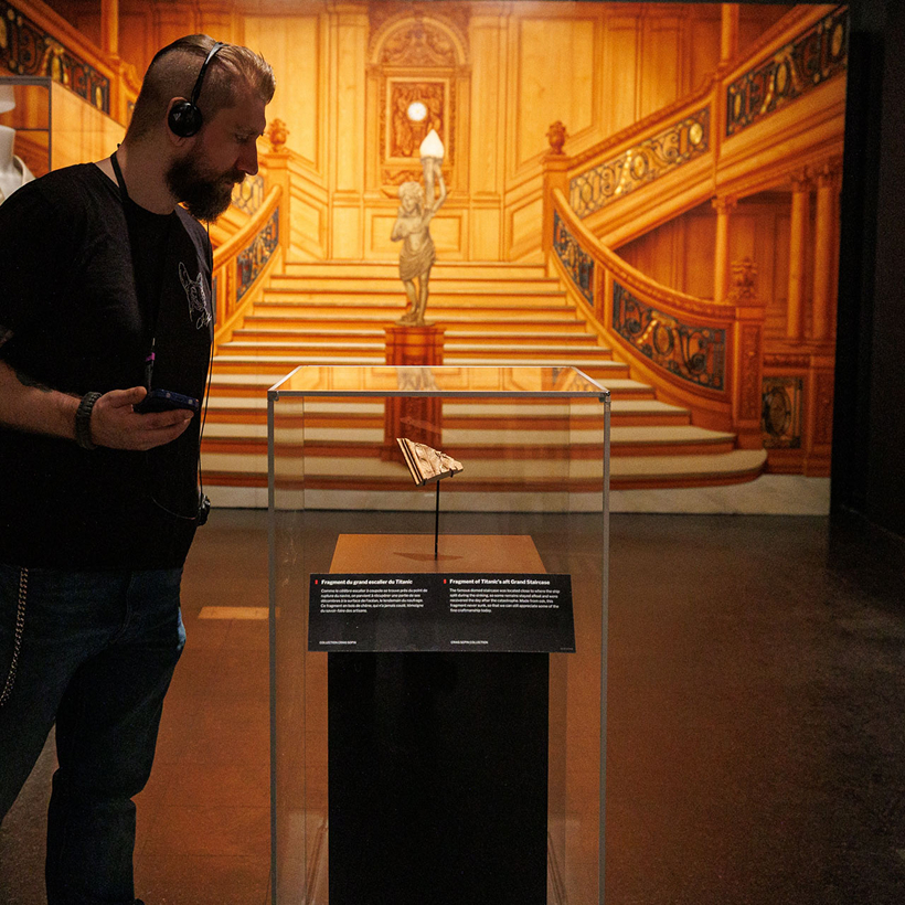 Museum visitor listening to exhibition content on an Imagineear audio guide